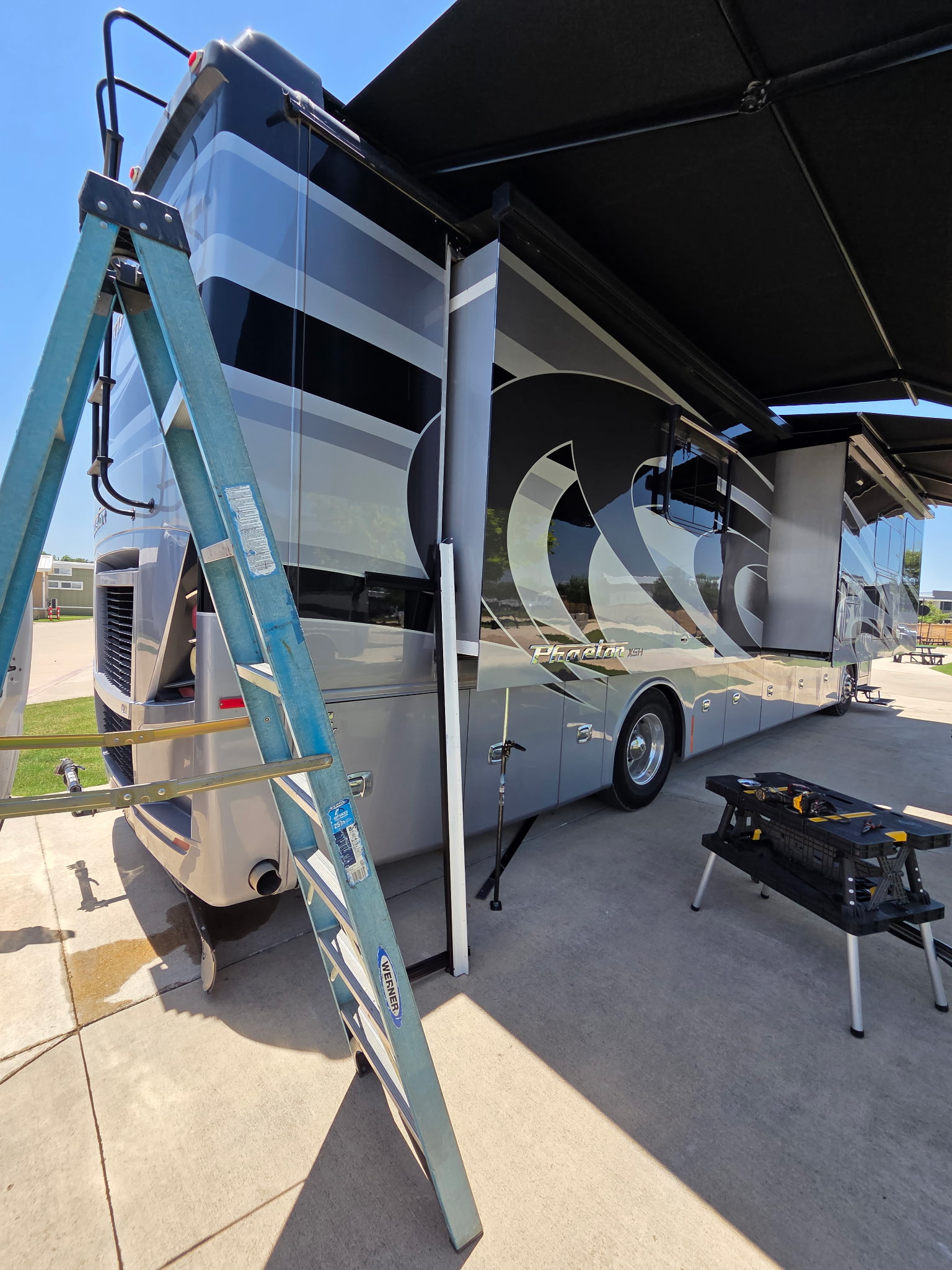 James working on a Class A motorhome on site